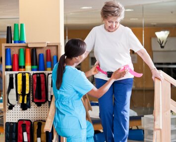 A senior short-term rehab patient at physical therapy